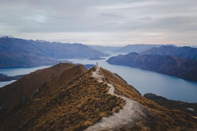 Stunning Panoramic View of Roys Peak in New Zealand with Distant Mountains and Light Cloudscape – Free Download