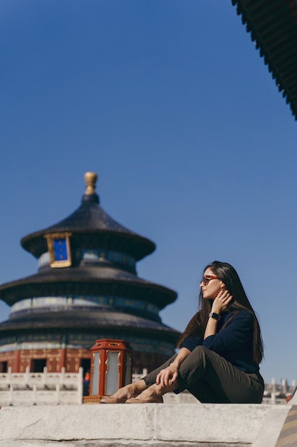 Brunette Girl Sitting on the Steps by Temple of Heaven in China – Free Stock Photo for Download