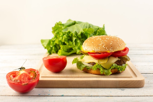 Delicious Chicken Burger with Cheese and Green Salad on Wooden Desk – Free Download