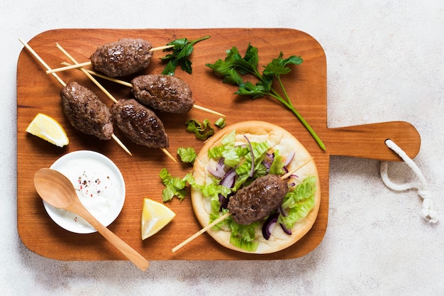 Delicious Arabic Fast-Food Skewers on Wooden Board – Free Download