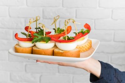 Bruschettas on a Plate Held by Chef – Free Download