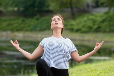 Young Beautiful Woman Practicing Yoga in a Green Park – Free Download