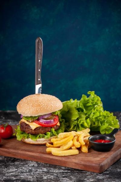 Knife and Meat Sandwich with Fries and Tomatoes – Free Stock Photo for Download