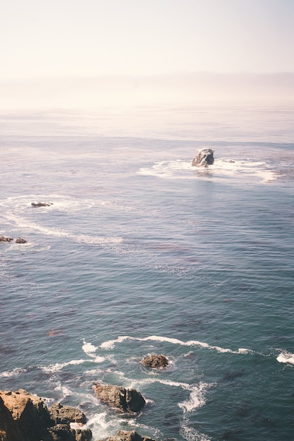 Vertical Image of Rocks by the Ocean and Cliff Shore – Free Download