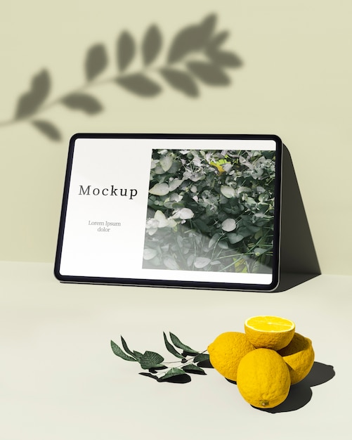 Tablet Displaying Citrus and Greenery – Free Download