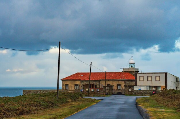 A Lighthouse on the Sea Coast: Free Stock Photo for Download