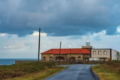 A Lighthouse on the Sea Coast: Free Stock Photo for Download