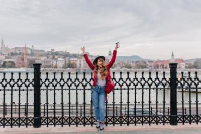 Blissful Lady in Red Jacket Posing on Embankment – Free Stock Photo, Download for Free