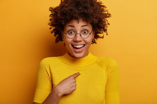 Happy Afro American Woman Asking “Who Me?” in Bright Yellow – Free Download