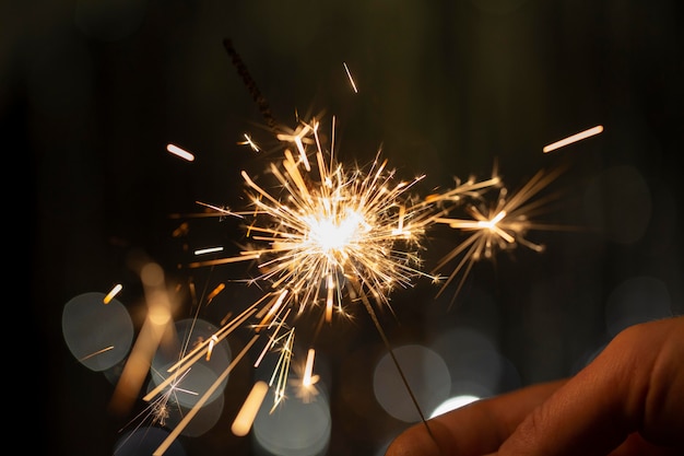 Festive Shiny Sparkler in the Dark – Free to Download Stock Photo