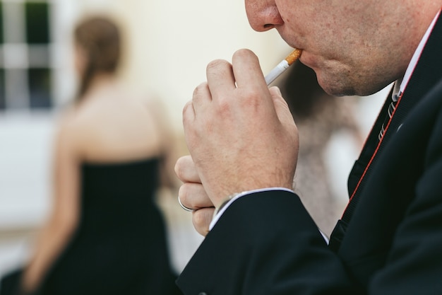 Man Hiding Cigar from Wind – Free Stock Photo, Download for Free