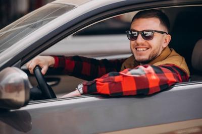 Handsome Man Sitting in a Car – Free Stock Photo for Download