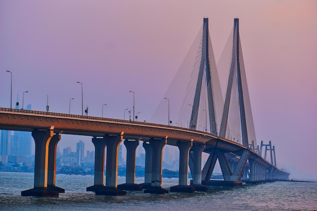 Stunning Sunset View: Bridge Over River Against Clear Sky – Free Download