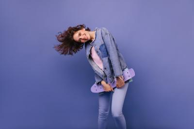 Joyful Caucasian Girl Dancing with a Skateboard – Free Stock Photo for Download