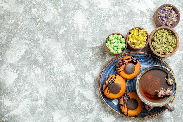 Delicious Little Cakes and Tea on White Surface – Free Stock Photo, Download Free