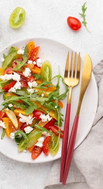 Top View of Tomato Salad with Feta Cheese and Cutlery – Free to Download