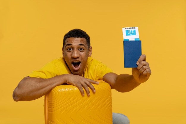 Medium Shot of a Man Holding a Passport – Free Download