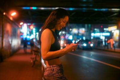 Young Woman Enjoying Nightlife in the City – Free Download