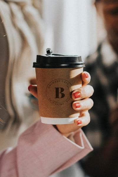 Coffee Cup Mockup in Female Hand – Free Download