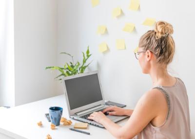 Woman Working on Laptop with Blank Black Screen – Free Stock Photo for Download