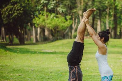 Woman Assisting Partner with Handstand | Free Stock Photo – Download Free