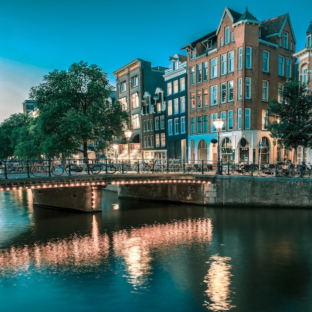 Nights in Amsterdam: Stunning Views of Canal Houses and Bridges – Free Download