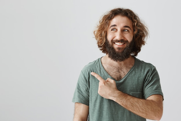 Delighted Middle-Eastern Man Pointing Enthusiastically – Free Stock Photo for Download