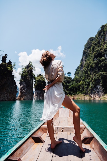 Fashion Portrait of Young Woman on Vacation on Asian Wooden Boat – Free Download