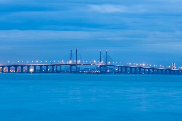 Stunning Suspension Bridge Over Sea Under Cloudy Sky – Free Download