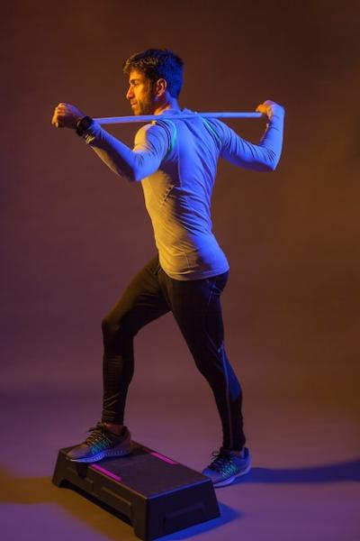 Man Exercising on Step Box with Stick – Free Stock Photo, Download for Free