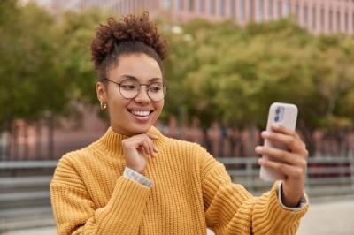 Curly Haired Girl Taking a Selfie Outdoors – Free Download