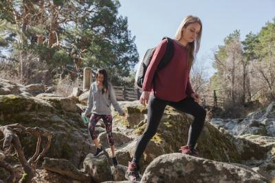 Young Woman Climbing a Rock – Free Stock Photo for Download