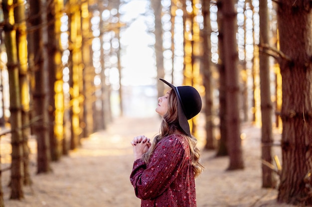 Beautiful Young Lady Praying in a Forest – Free Download