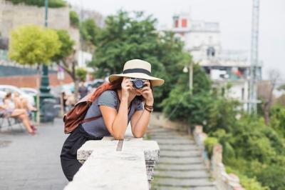 Female Tourist Capturing Moments on a Balcony – Free Download