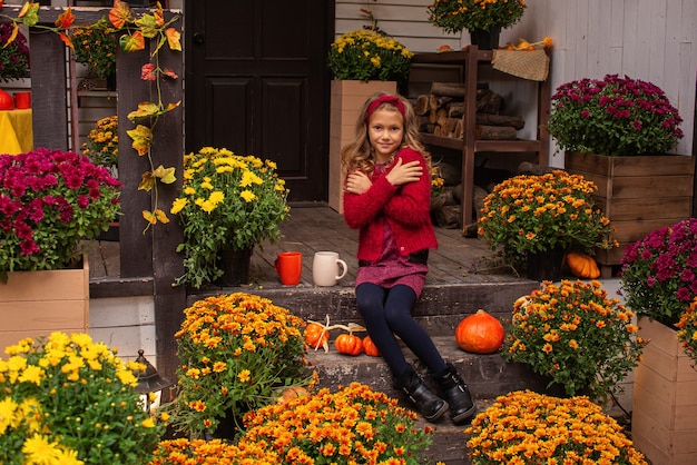 Cute Girl Enjoying Tea Outdoors in Cozy Autumn Attire | Free Stock Photo for Download