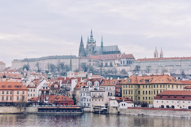 City Buildings by River Under Cloudy Sky – Free Stock Photo, Download Free