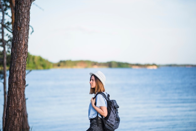 Scenic Woman with Backpack by the Lake – Free Stock Photo for Download