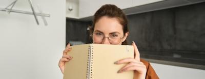 Portrait of a Cute Brunette Woman in Glasses at Home – Free Download