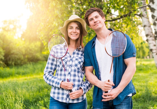 Cheerful Couple Enjoying Badminton in the Park – Free Stock Photo Download