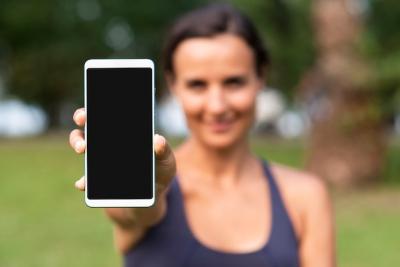 Smartphone Mock-Up Featuring a Blurred Woman – Free Download