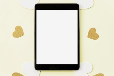 Digital Tablet Surrounded by Heart Stickers on Yellow Background – Free Download