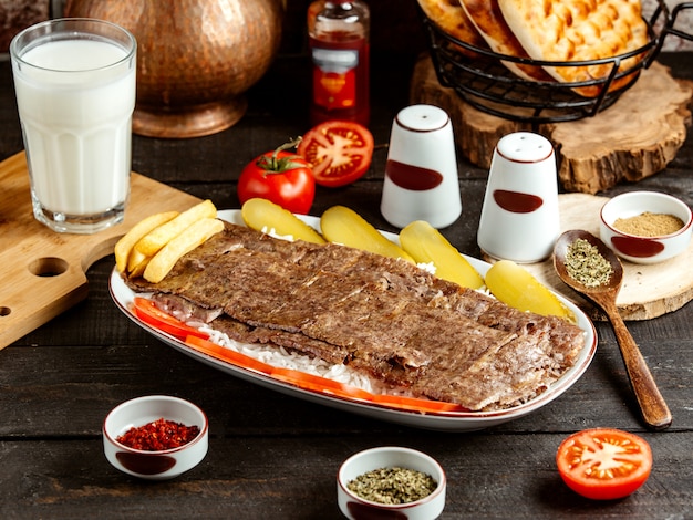 Traditional Turkish Kebab Iskender on Rice with Pickles – Free Download