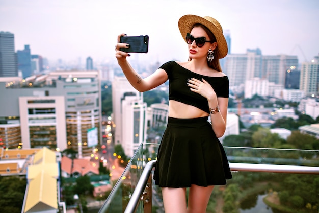 Elegant Young Woman in Trendy Summer Outfit Taking a Selfie at a Luxury Hotel Terrace – Free Stock Photo, Download Free