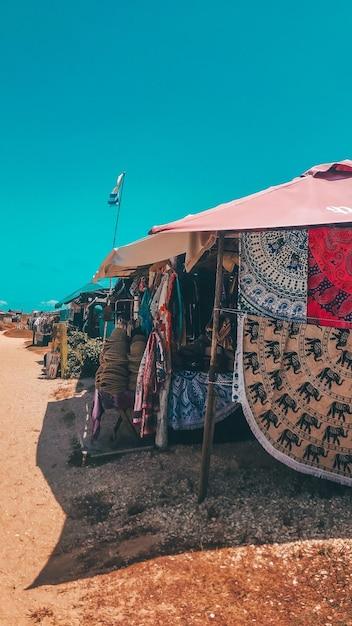 Clothes Drying on Beach Against Clear Blue Sky – Free Download