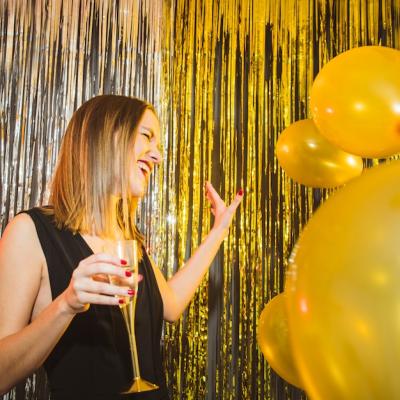 Laughing Woman with Balloons at New Year Celebrations – Free Stock Photo for Download