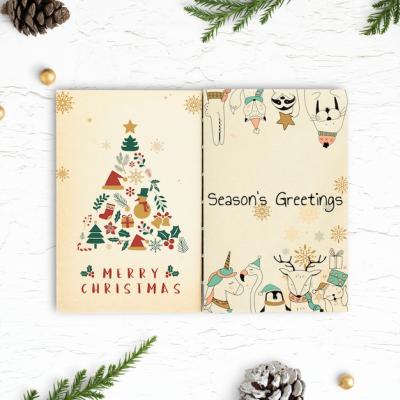 Christmas Illustrations in a Notebook Mockup – Free Download