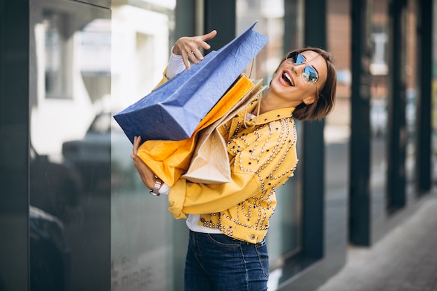 Shopping in the City: Young Woman with Bags – Download Free Stock Photo