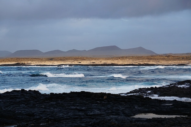 Rocky Beach and Mountains in Fuerteventura, Spain – Free Download