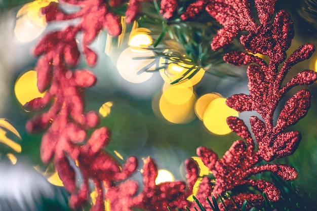 Decorative Red Wreath on a Christmas Tree with Bokeh Lights – Free Download