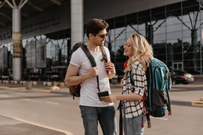 Travelers in Sunglasses with Backpacks at Airport – Free Stock Photo, Download for Free